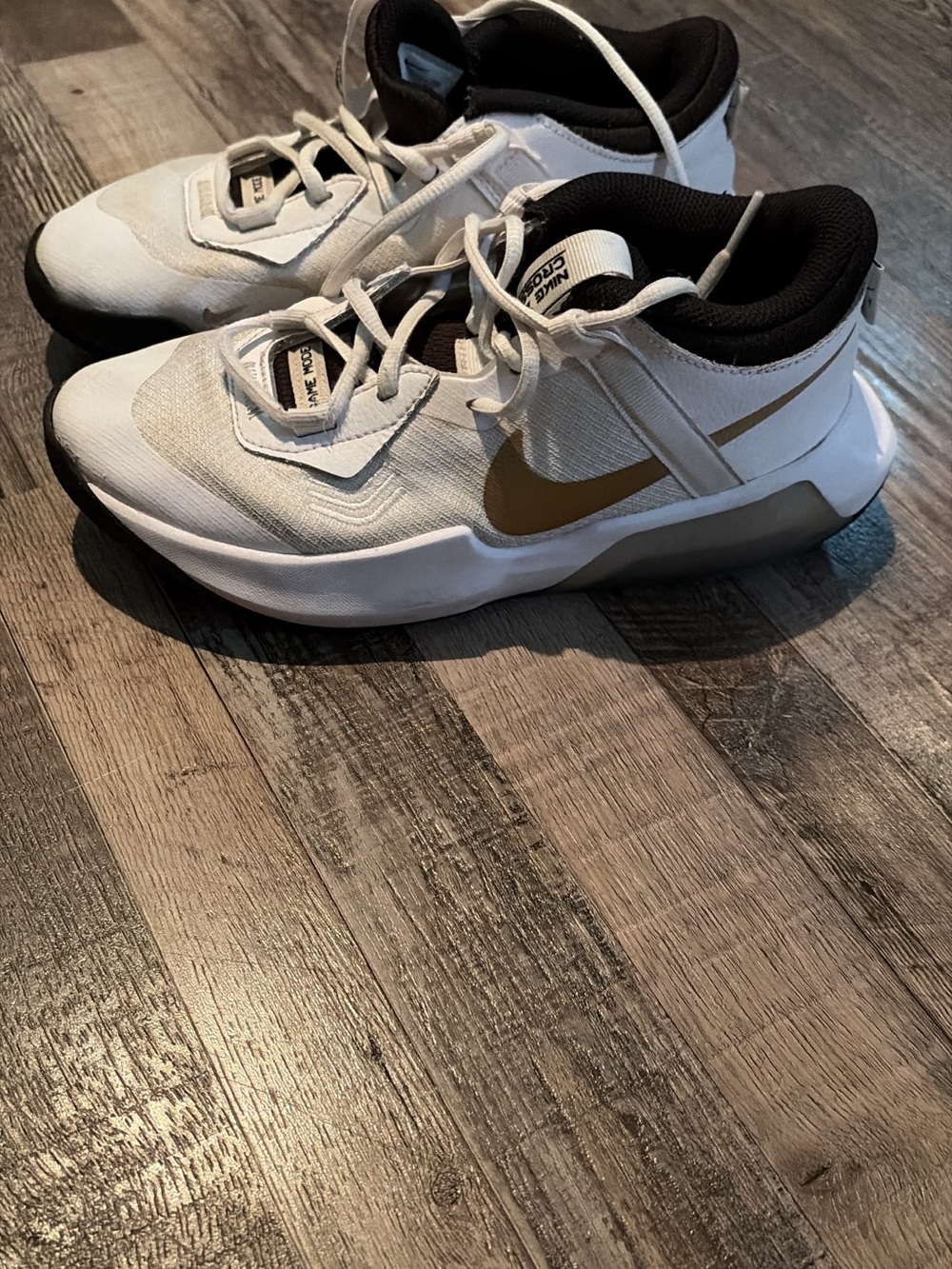 Nike Kids White Sneakers with Gold Swoosh